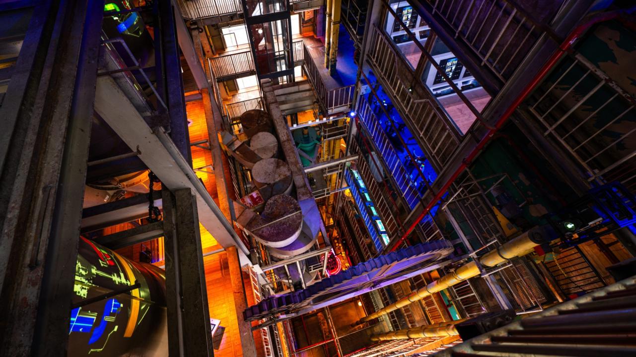 Interior of The Chocolate Factory in Veghel showing multiple levels, machines and industrial installations
                