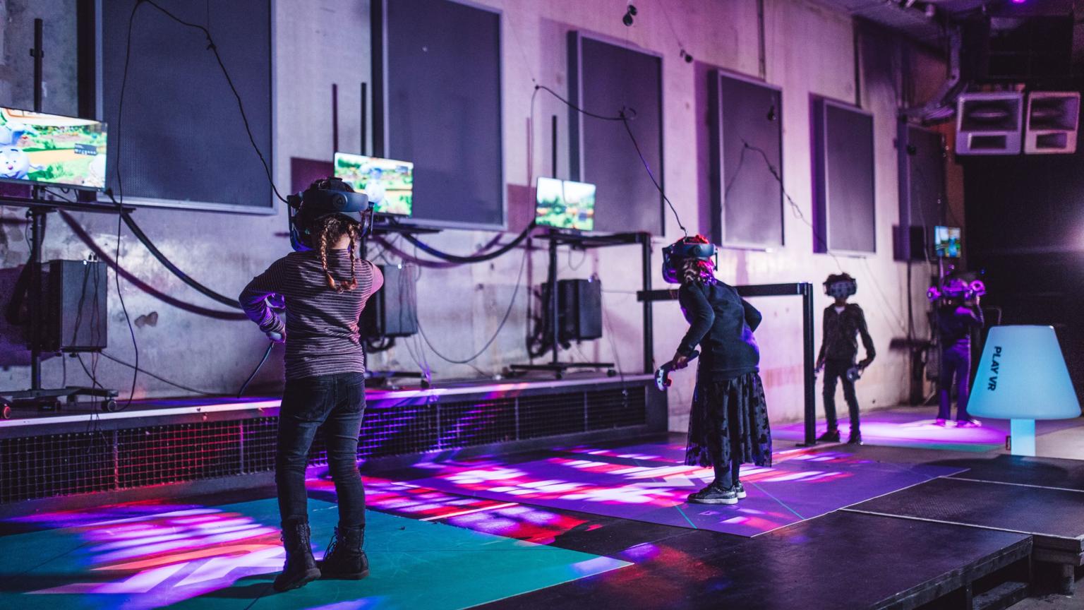 Children enjoying a VR attraction with headsets and motion seats