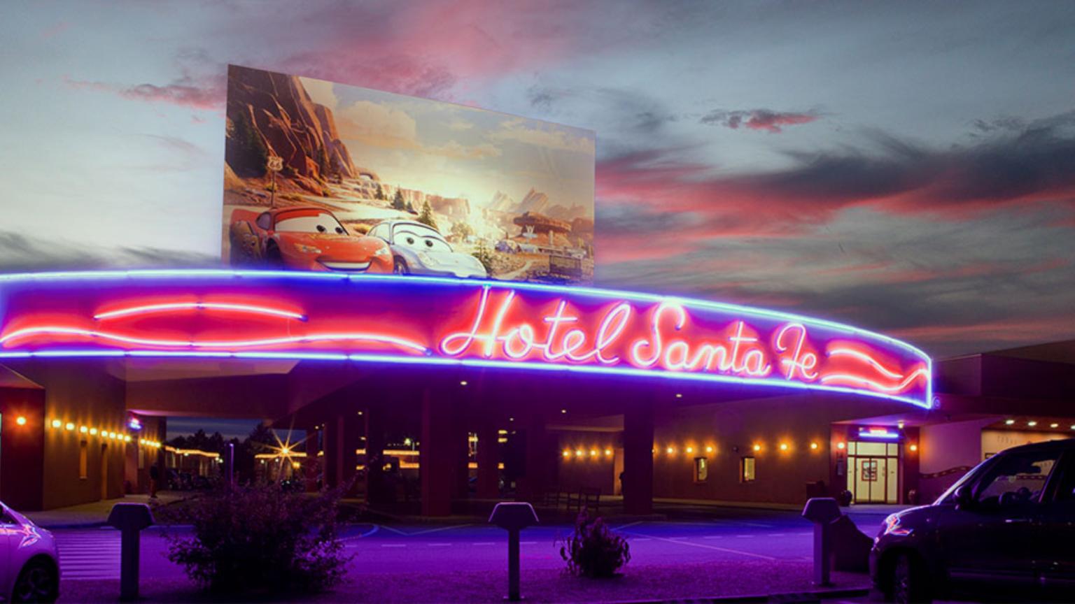 Entrance of Disney Hotel Santa Fe with neon lights inspired by Disney Pixar Cars.