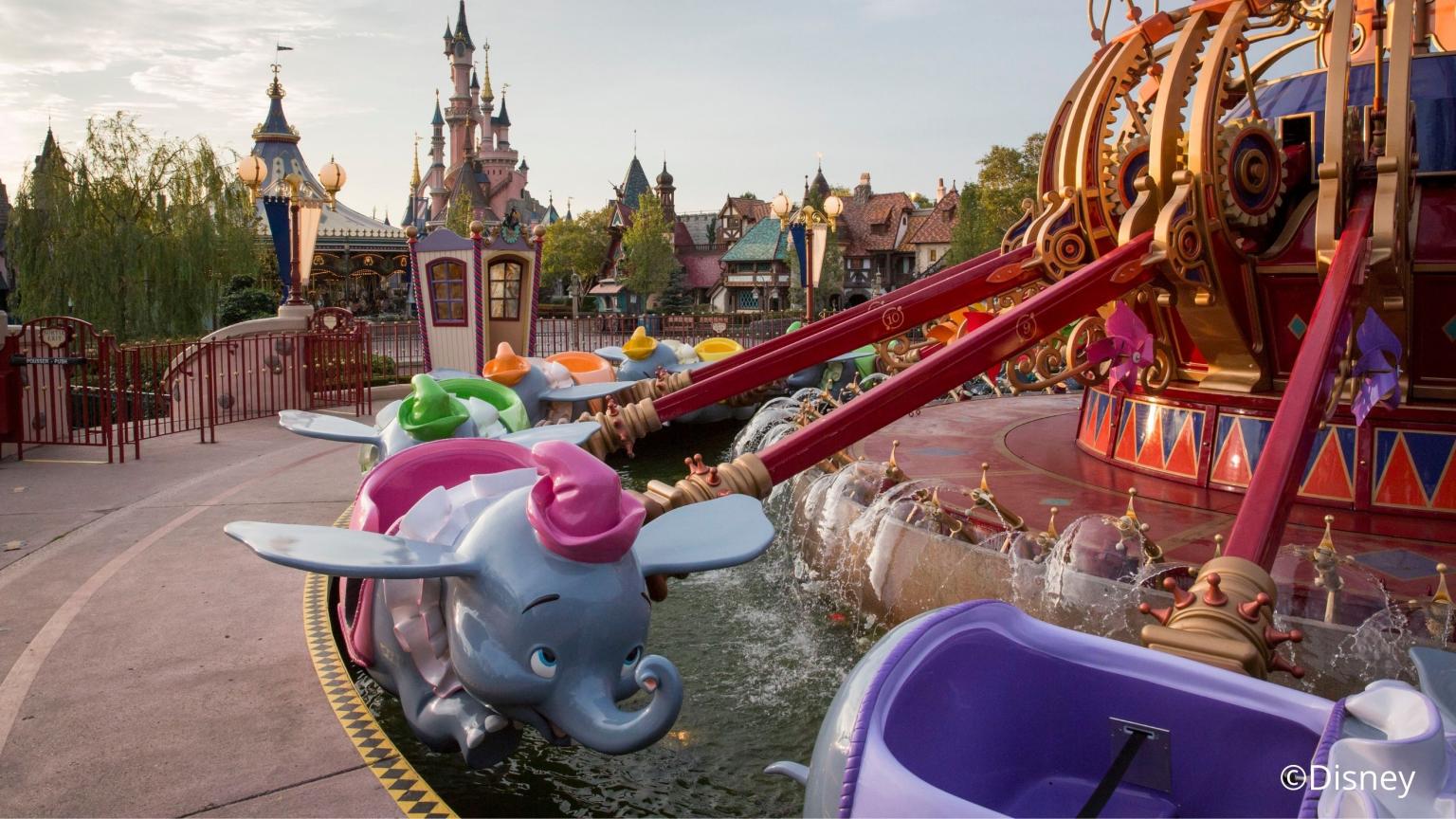 Dumbo ride with flying elephants in Disneyland and the castle in the background